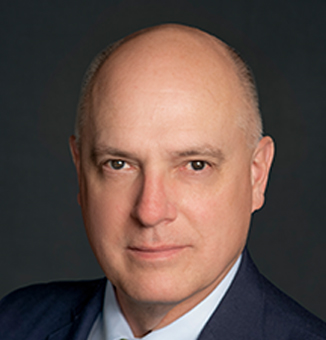 head shot of john hiovich, vice president purchasing